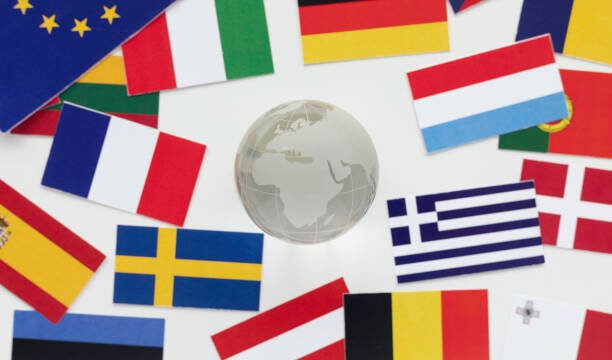 directly above view of an abundance of flags and glass globe.