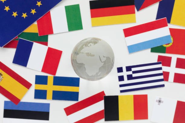 directly above view of an abundance of flags and glass globe.